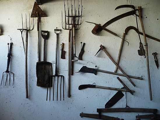 Farm tools on wall - Public Domain Photograph