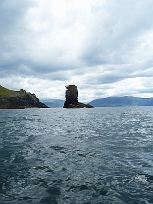 Rocky cliffs in sea - Public Domain Photograph